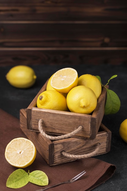 fresh ripe lemons in wooden box