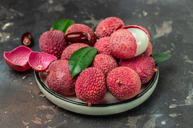 fresh ripe lychee tropical fruit Thailand on a dark background Food background Close up