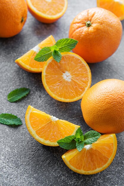 Fresh ripe oranges on concrete background