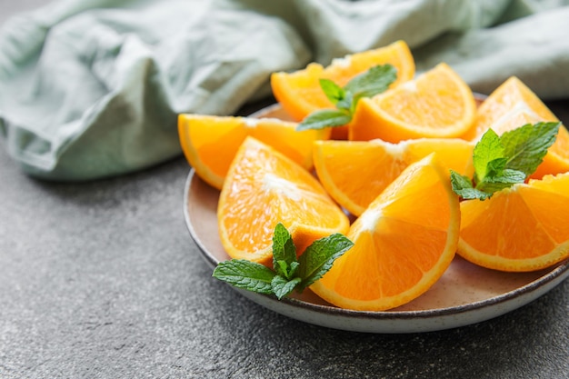 Fresh ripe oranges on concrete background