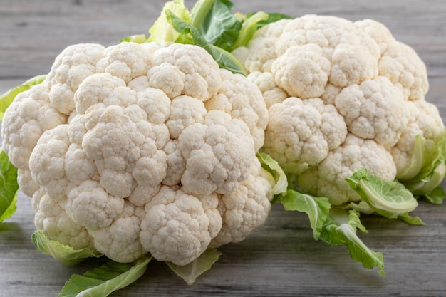 Fresh ripe organic cauliflower on wooden background. Healthy eating