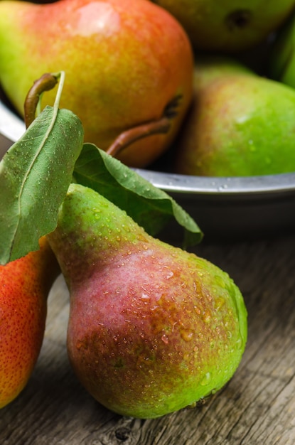 Fresh ripe pears on wooden table