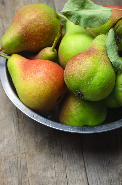 Fresh ripe pears on wooden table