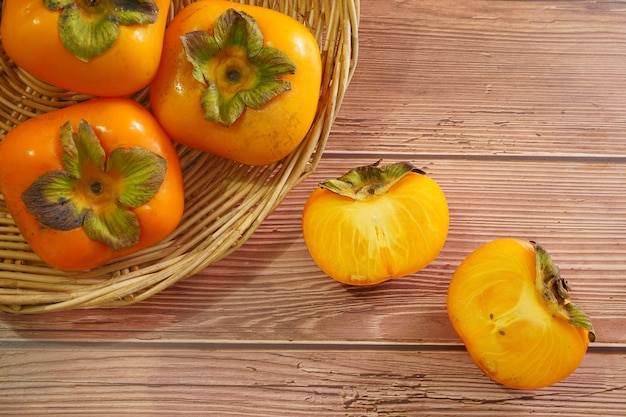 Fresh ripe Persimmon or Chinese date plum persimmon photo