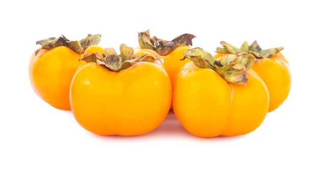 Fresh ripe persimmons isolated on white background