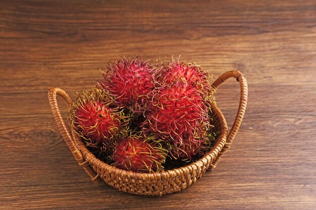 Fresh and ripe rambutan on the table selective focus image Close up