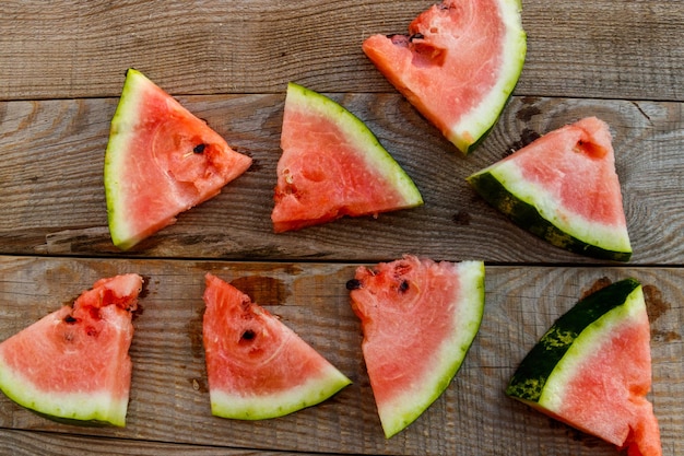 Fresh ripe sliced watermelon on rustic wooden table