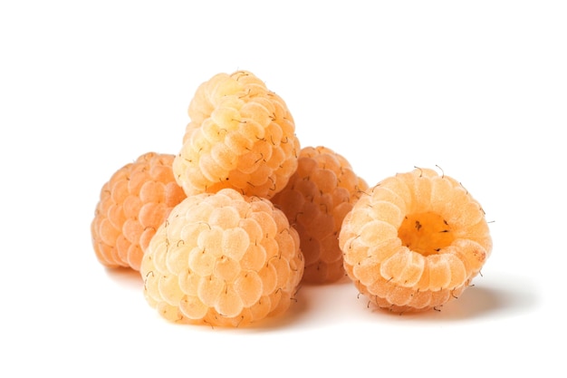 Fresh ripe yellow raspberries on a white background