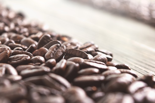 Photo fresh roasted coffee beans. selective focus, bokeh. the concept of fresh aromatic coffee.