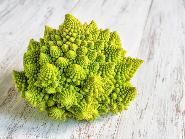 Fresh romanesco on a white wooden table