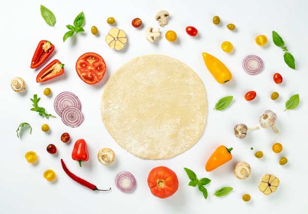 Photo fresh round dough with ingredients for cooking homemade italian pizza on white background, top view flat lay