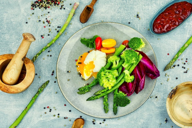 Fresh salad of asparagus lettuce and poached eggs