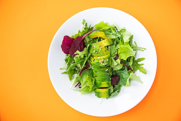 Fresh salad avocado leaf mix lettuce spinach arugula chard lettuce meal snack on the table