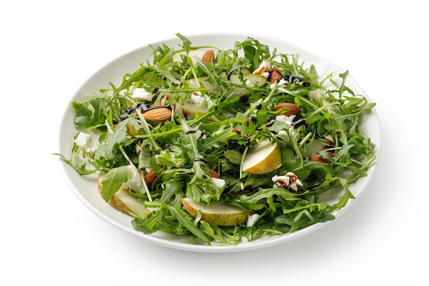 Fresh salad with green arugula feta cheese and pears Green salad isolated on white background 