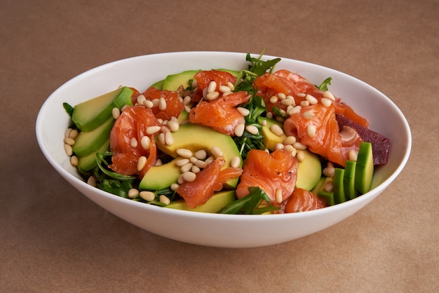 Fresh salad with salmon and avocado