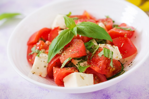 Fresh salad with tomato, mozzarella and basil