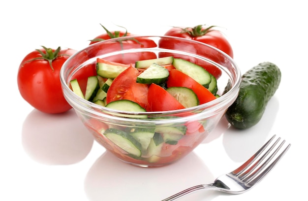 Fresh salad with tomatoes and cucumbers isolated on white