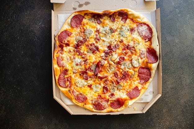 Fresh salami pizza with cheese and sausages