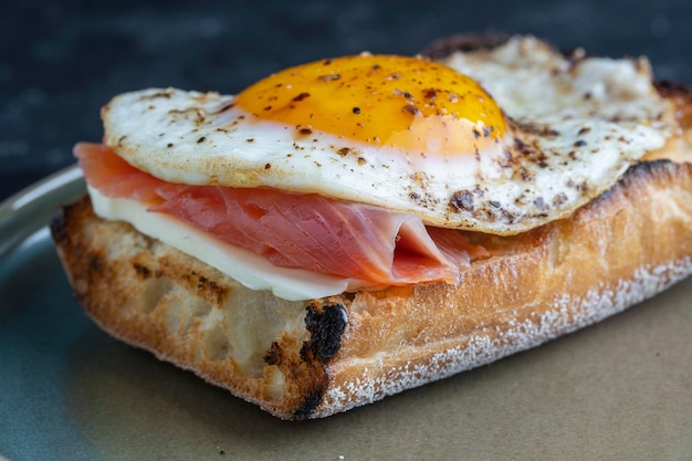 Fresh salmon egg sandwich close up Salted salmon fried egg butter and white bread