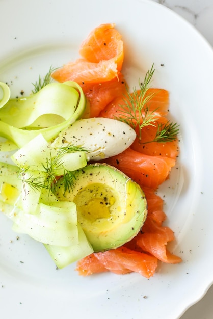 Fresh salmon salad with avocado and creamy mascarpone cheese flat lay table flatlay top view food photography and recipe inspiration for cooking blog or cookbook