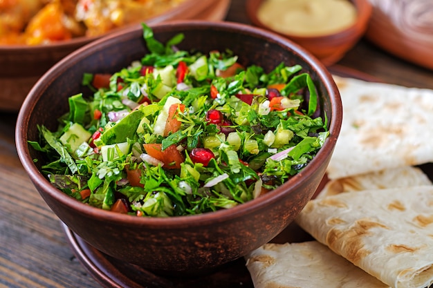 Fresh salsa salad with tomatoes, pepper,onions and herbs. Mexican vegetable salad. Vegan food.