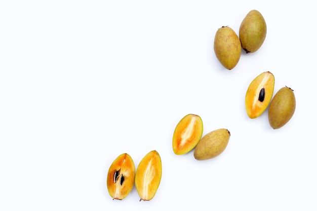 Fresh sapodilla fruit on white background