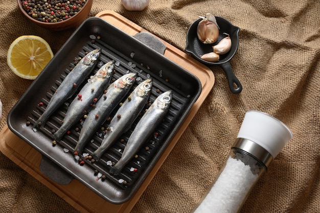 Fresh sardines on rustic background