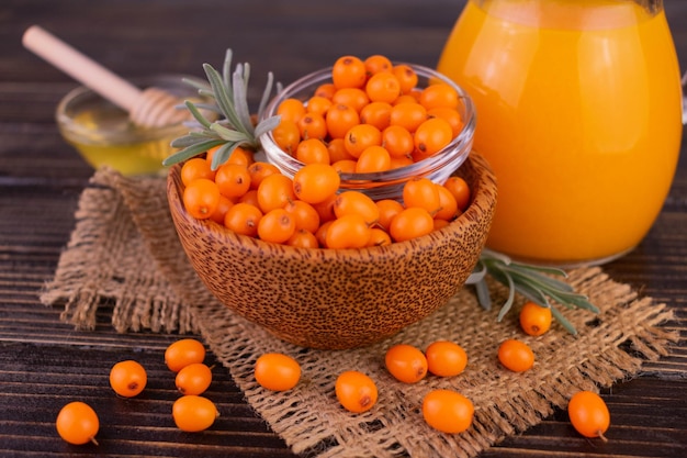 Fresh sea buckthorn and vitamin juice from sea buckthorn.