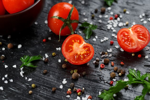 Fresh Sliced Cherry Tomatoes with spices coarse salt and herbs