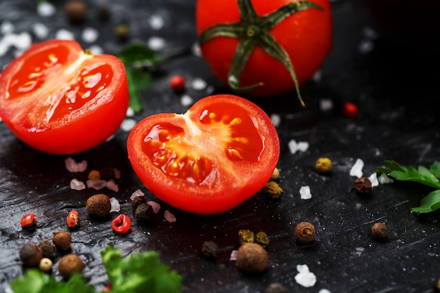 Fresh Sliced Cherry Tomatoes with spices coarse salt and herbs