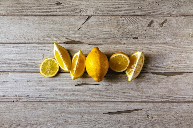 Fresh sliced lemon on wooden natural background