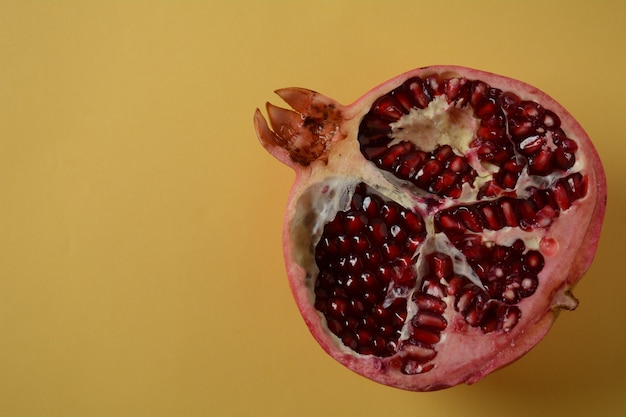 Fresh sliced pomegranates. Half pomegranate and pomegranate grains