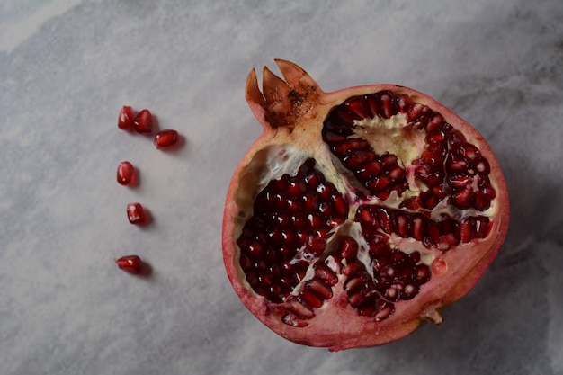 Fresh sliced pomegranates. Half pomegranate and pomegranate grains