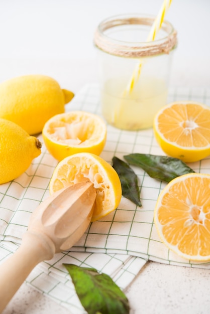 Fresh sliced yellow lemons on a white background, selective focus