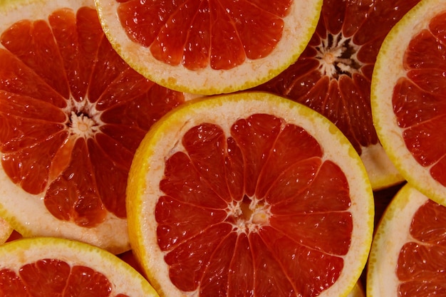 Fresh slices of grapefruits as background