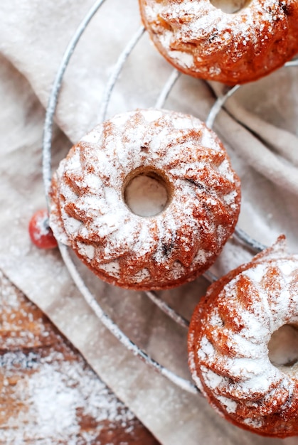 Fresh Small Baked Cakes Dusted with Icing Sugar