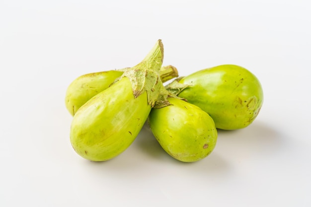 Fresh small eggplants on a pure white background