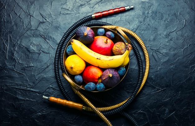 Fresh smoking shisha with fruit.Oriental hookah on fruit tobacco.Smoking hookah