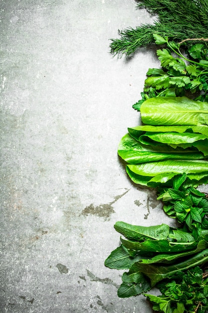 Fresh spicy greens on the stone table