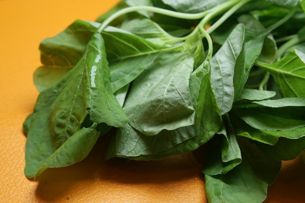 Fresh spinach leaves on table