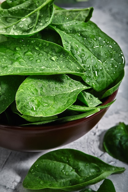 Fresh spinach leaves, with dew drops, close-up, grocery delivery vegetarian diet with herbs close-up photo for delivery stores.