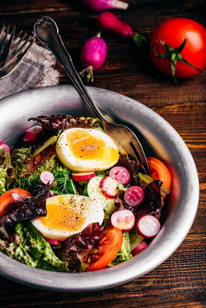 Fresh spring salad with homegrown vegetables and boiled eggs