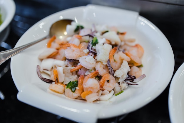 Fresh steamed seafood with shrimps prawns crabs squid and mussels