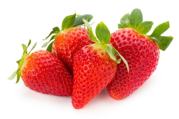 Fresh strawberries close up on white surface.