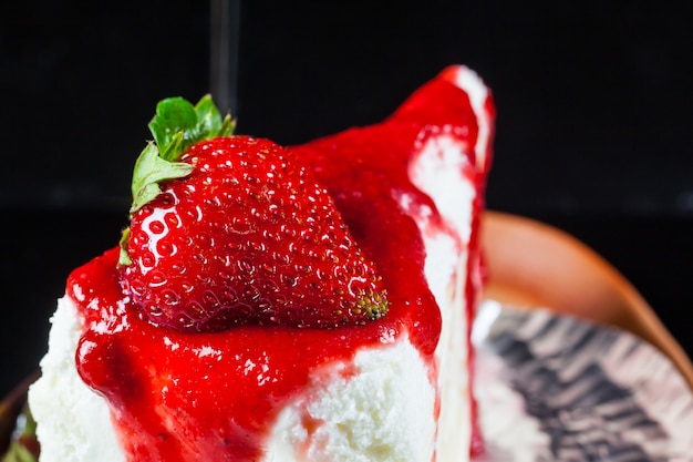 Fresh strawberries on crepe cake with strawberry sauce. and fresh strawberries.