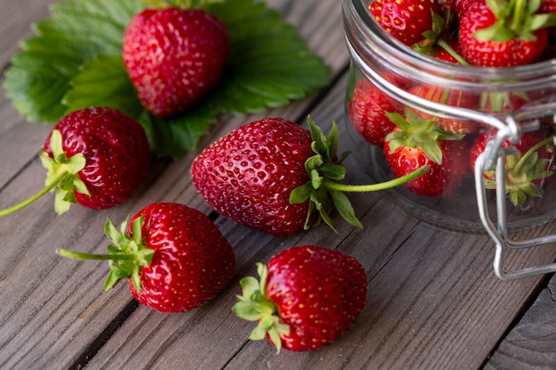 Fresh strawberries on a wooden table Farmed organic food Healthy eating