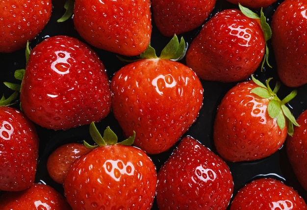 Fresh strawberry fruits with visible water drops