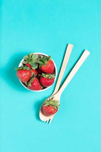 Fresh strawberry and juice on wood table. flat lay.