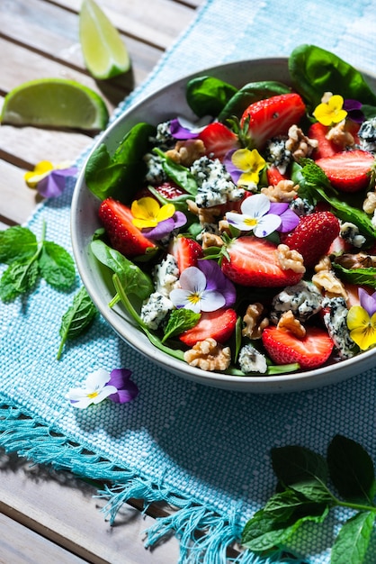 Fresh Sumer Salad with Strawberry on Table