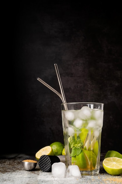 Fresh summer caipirinha cocktail on concrete background